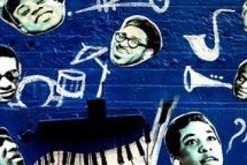 Jazz artists on a blue wall along with instruments